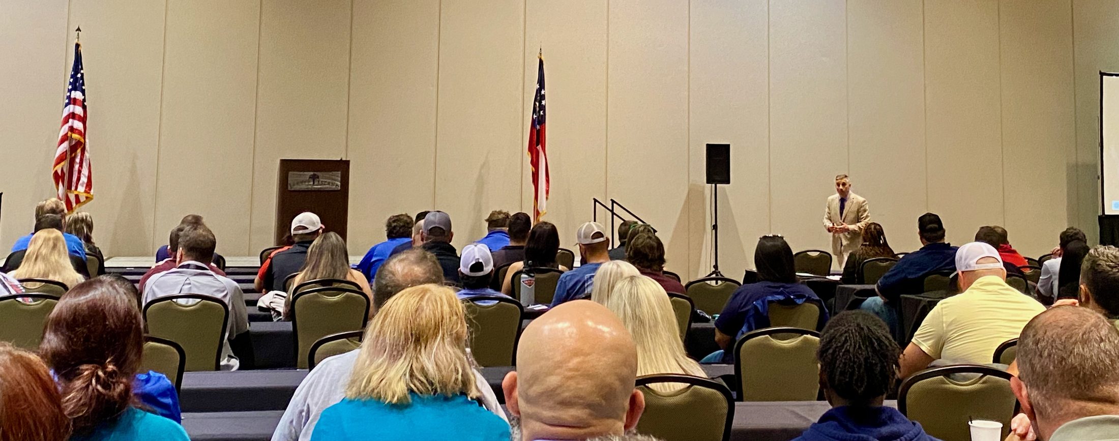 Rom Duckworth presenting to a full conference session.