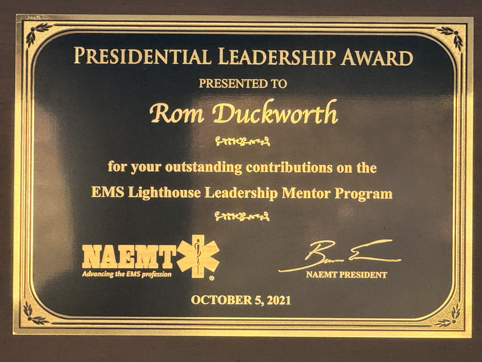 NAEMT Presidential Leadership Award plaque presented to Rom Duckworth, October 5, 2021.