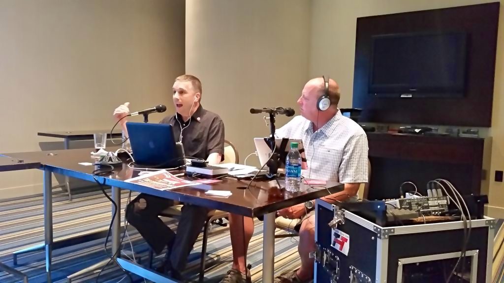 Rom Duckworth recording a podcast at a conference.